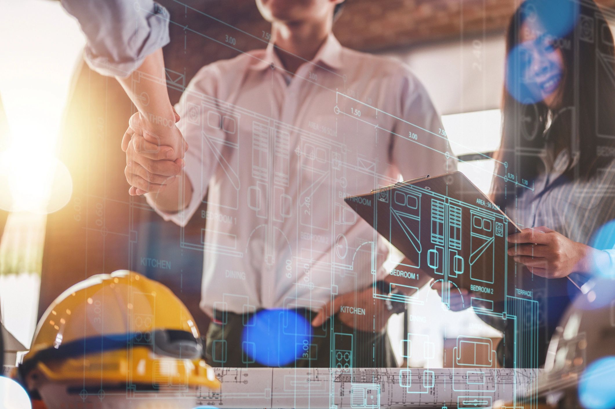 Shake hands, blueprint, technology discussion between architects and contractors.